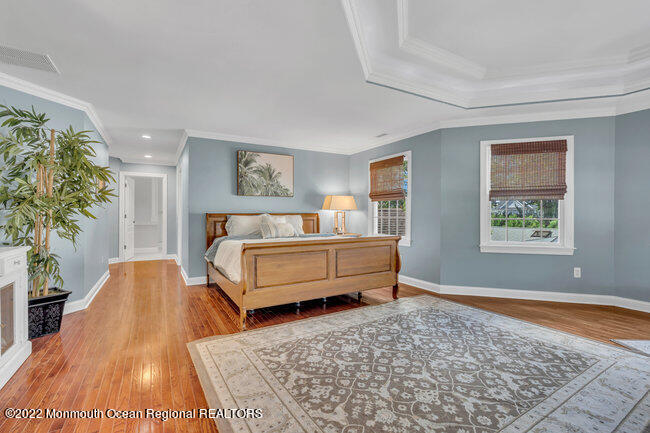 2107 3rd Avenue Spring Lake, NJ 07762 - Photo 28 of 40 a bedroom with a bed rug and wooden floor