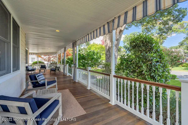 a view of a patio with wooden floor