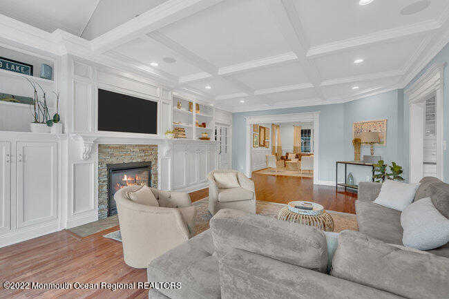 2107 3rd Avenue Spring Lake, NJ 07762 - Photo 35 of 40 a living room with furniture a fireplace and a flat screen tv