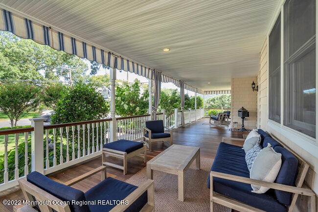 2107 3rd Avenue Spring Lake, NJ 07762 - Photo 40 of 40 a balcony with chairs and a table