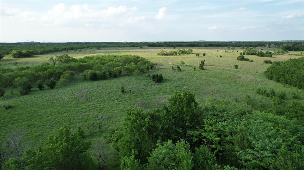 11 Old Tioga Road, Unit 22 ACRES Gunter, TX 75058 - Photo 5 of 6 a view of a city with lush green forest