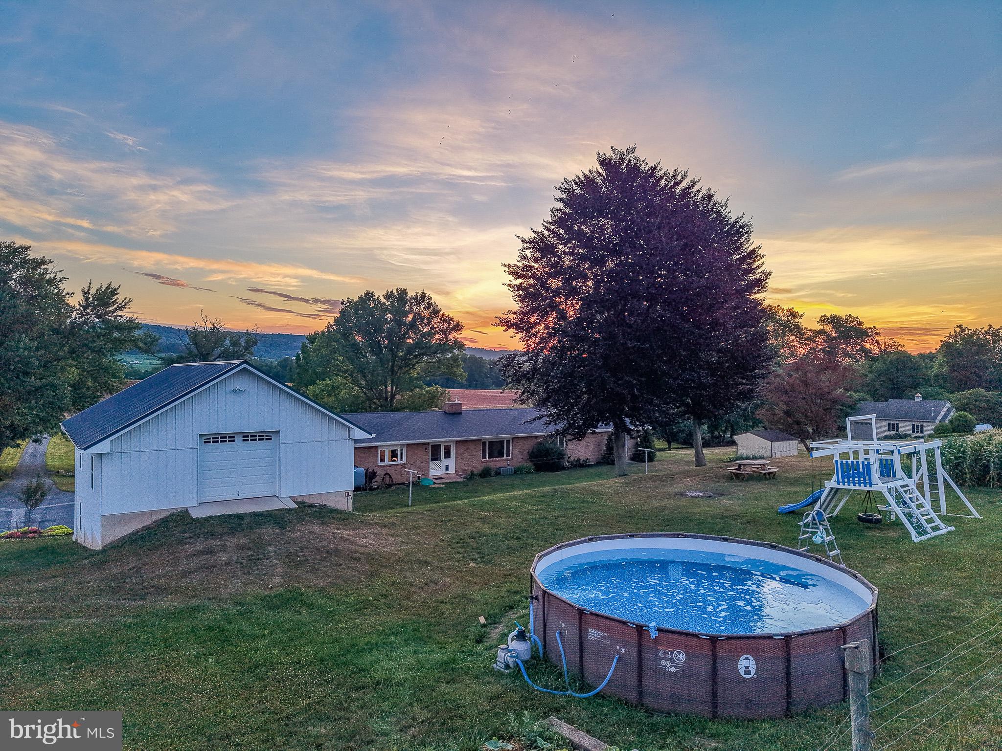 475 South Cocalico Road Denver, PA 17517 - Photo 5 of 91 Tranquil sunset over a charming homestead.