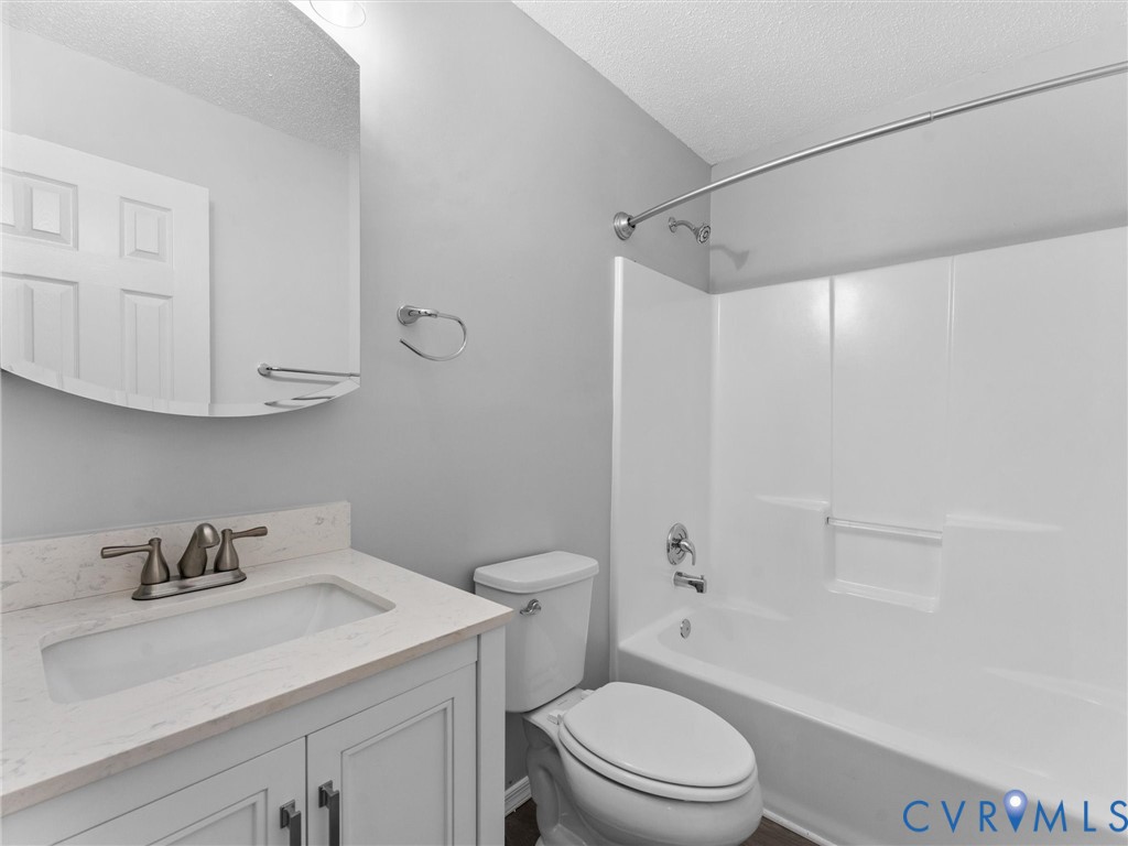 6927 Carsley Road Waverly, VA 23890 - Photo 30 of 51 Vanity with a light-toned countertop and dual cabi