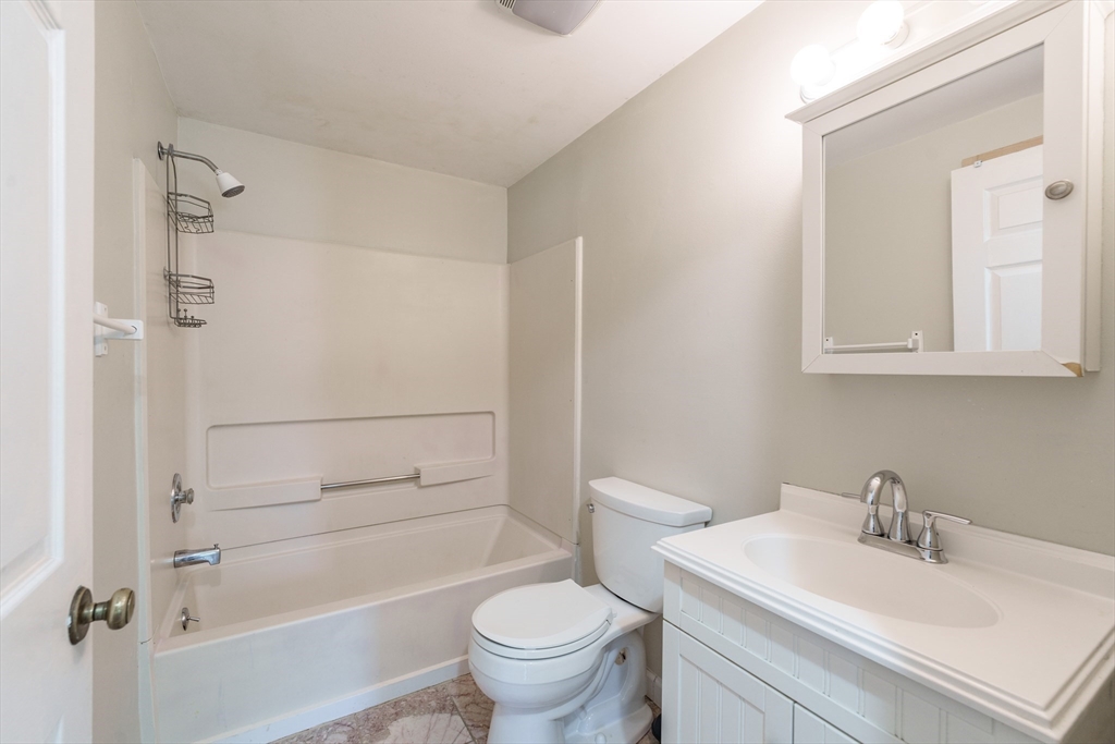 75 Puritan Road Springfield, MA 01119 - Photo 11 of 33 a bathroom with a sink toilet and shower
