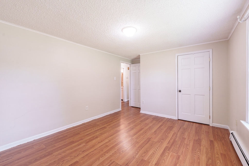 75 Puritan Road Springfield, MA 01119 - Photo 12 of 33 a view of an empty room with wooden floor