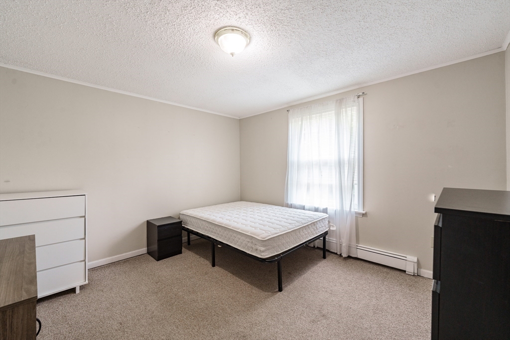 75 Puritan Road Springfield, MA 01119 - Photo 17 of 33 a room with a bed and a window