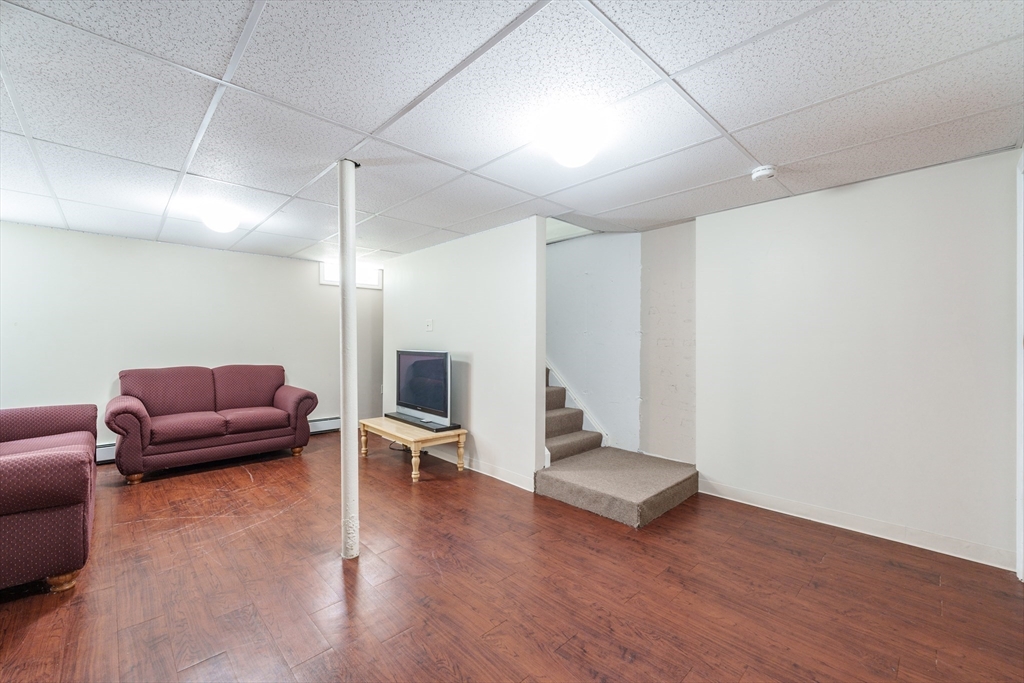 75 Puritan Road Springfield, MA 01119 - Photo 20 of 33 a living room with furniture and a wooden floor