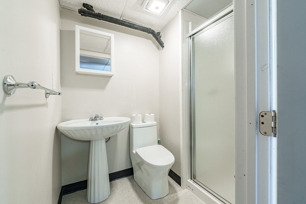 75 Puritan Road Springfield, MA 01119 - Photo 22 of 33 a bathroom with a sink toilet and shower