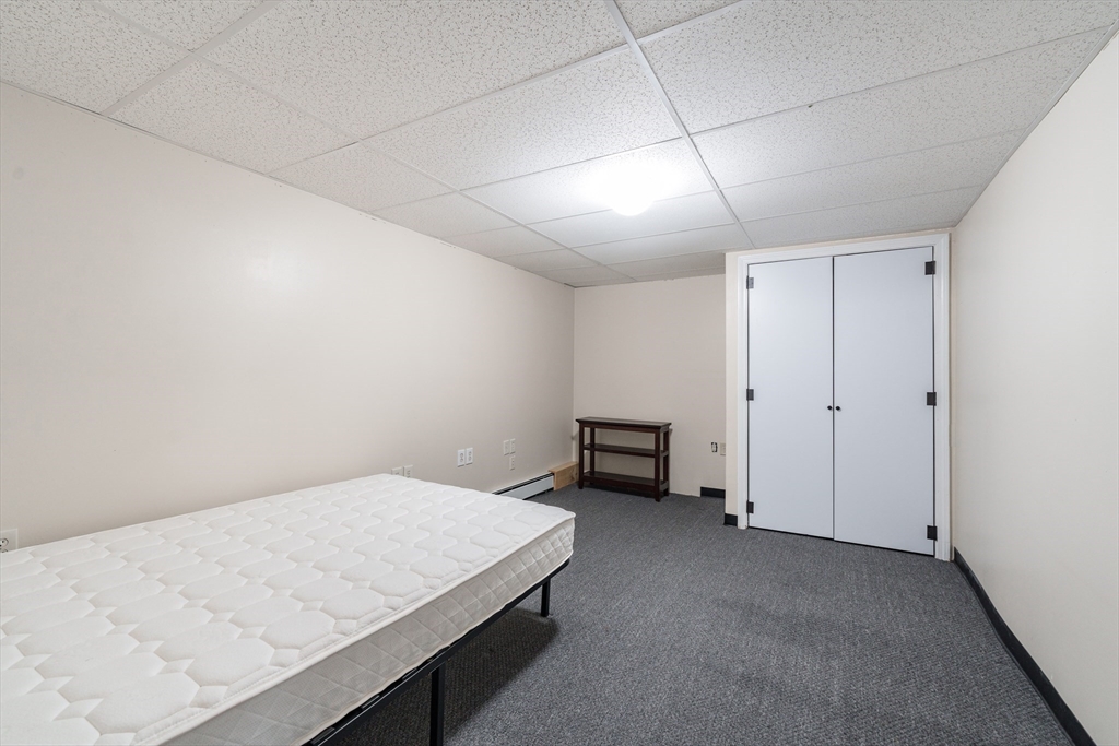 75 Puritan Road Springfield, MA 01119 - Photo 23 of 33 a room with a bed and a table in it