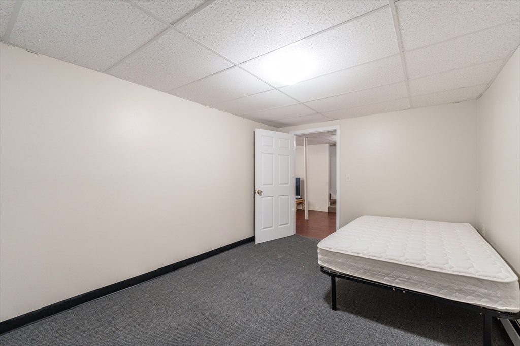 75 Puritan Road Springfield, MA 01119 - Photo 24 of 33 a room with a bed and a table in it