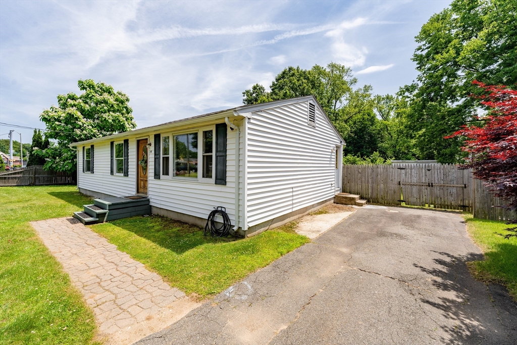 75 Puritan Road Springfield, MA 01119 - Photo 29 of 33 a view of a white house with a yard and a garden