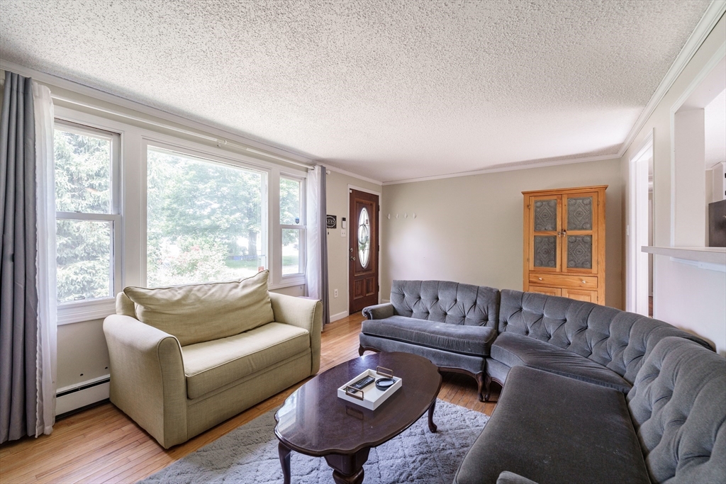 75 Puritan Road Springfield, MA 01119 - Photo 5 of 33 a living room with furniture and a large window
