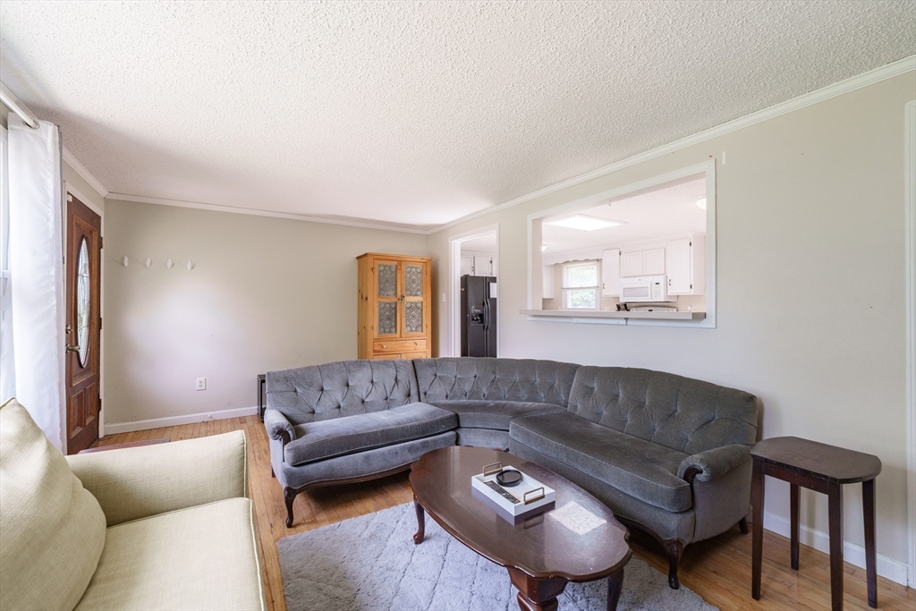75 Puritan Road Springfield, MA 01119 - Photo 6 of 33 a living room with a couch and a window