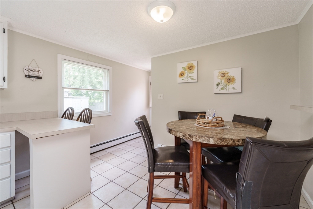 75 Puritan Road Springfield, MA 01119 - Photo 10 of 33 a view of a dining room with furniture and a table