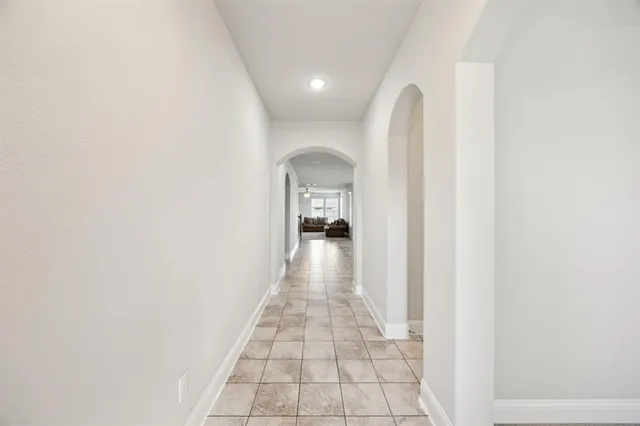 a view of a hallway with a white walls