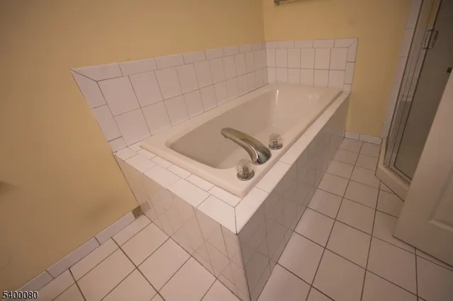 a white bath tub sitting in a bathroom