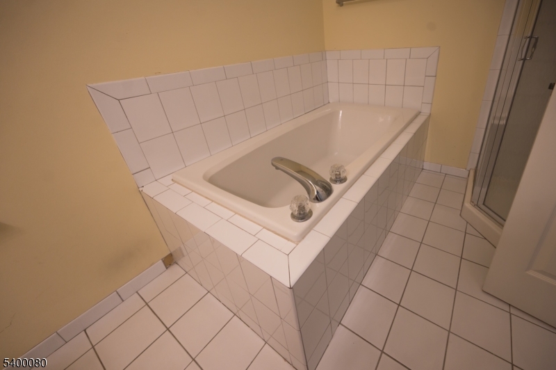 6 Davenport Road Montville, NJ 07045 - Photo 12 of 28 a white bath tub sitting in a bathroom