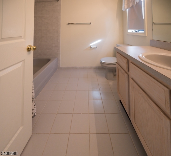 6 Davenport Road Montville, NJ 07045 - Photo 14 of 28 a bathroom with a granite countertop sink a toilet and a bathtub