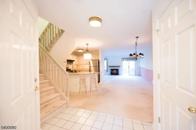 a view of entryway and kitchen