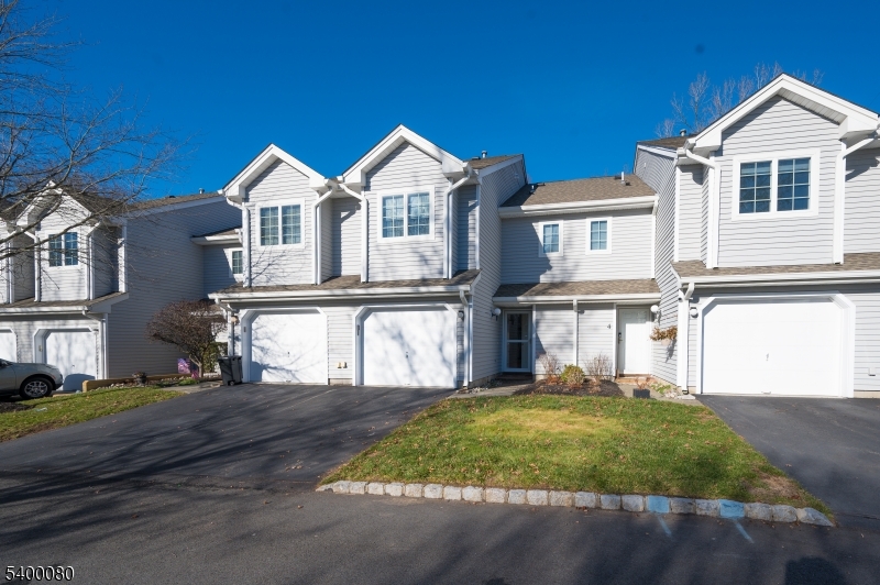 6 Davenport Road Montville, NJ 07045 - Photo 24 of 28 a view of a yard in front of a brick house with large windows