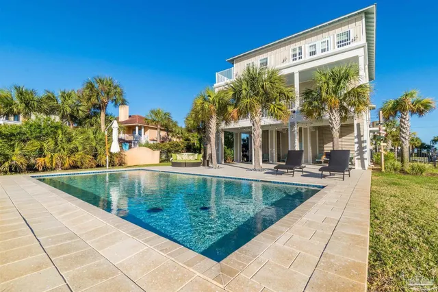 a view of a swimming pool with a patio