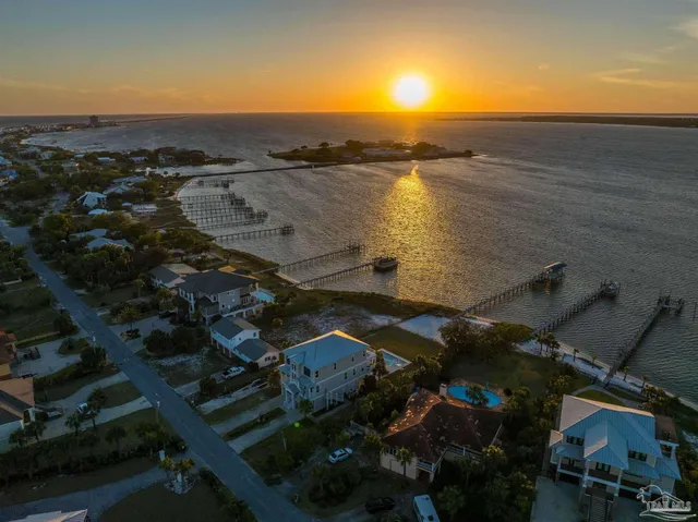 a view of a ocean with a building in the background
