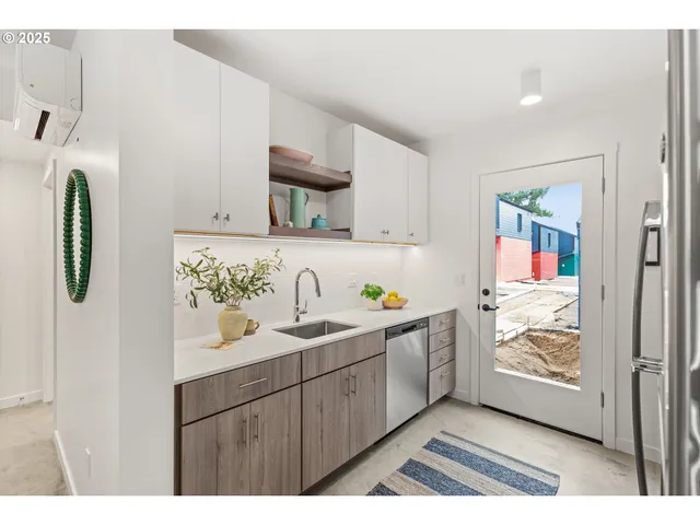 a kitchen with sink and cabinets