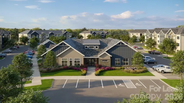 a view of a white house with a big yard and large trees