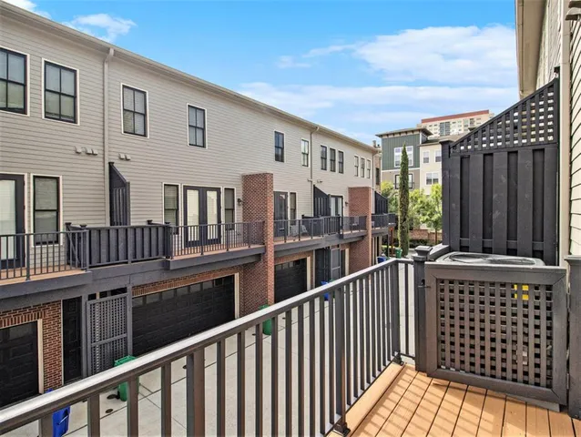 a view of a balcony with furniture