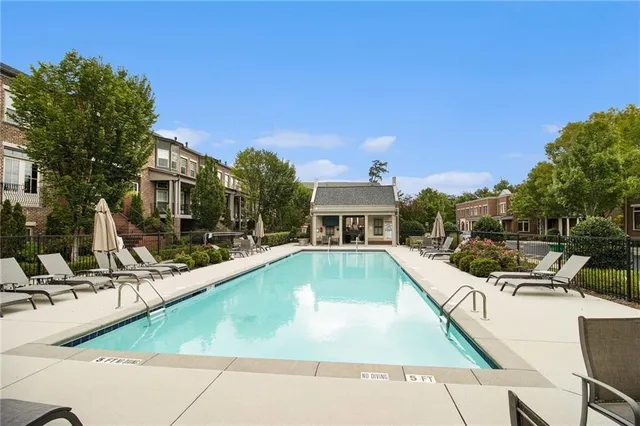 a view of a swimming pool with a patio
