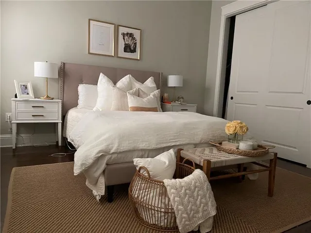 a bedroom with a bed and window