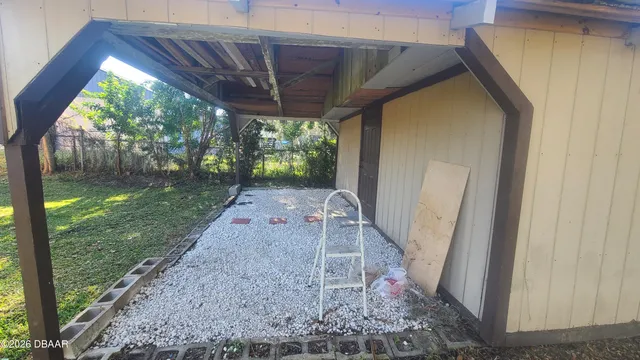 a view of a backyard with a small cabin