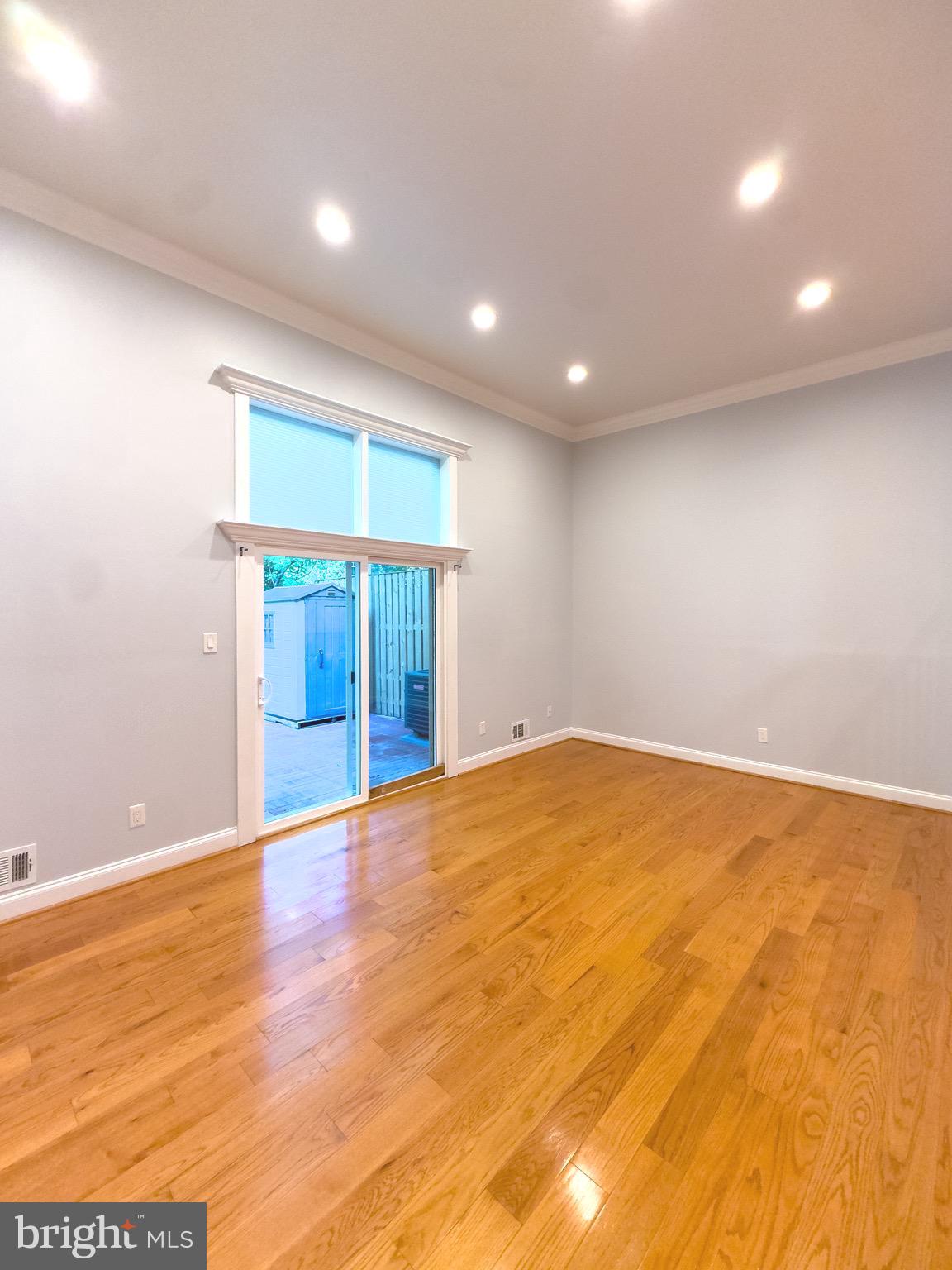 2419 Ansdel Court Reston, VA 20191 - Photo 11 of 41 a view of an empty room with wooden floor