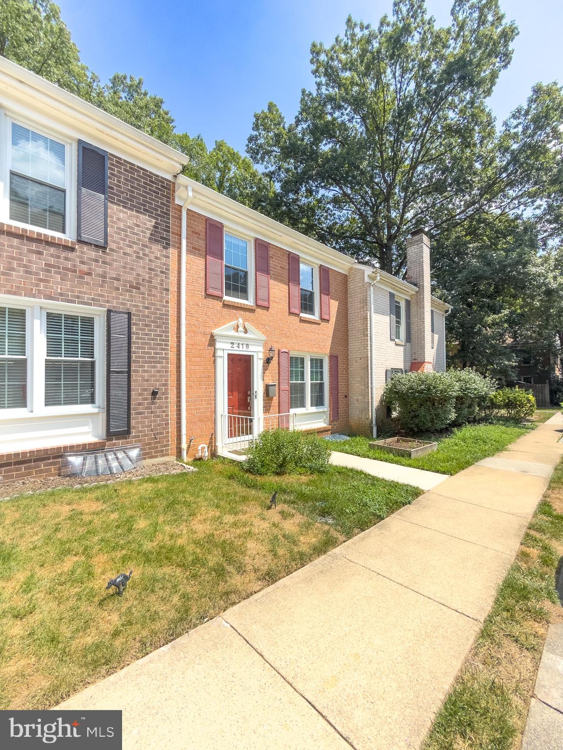 2419 Ansdel Court Reston, VA 20191 - Photo 2 of 41 a front view of a house with a yard