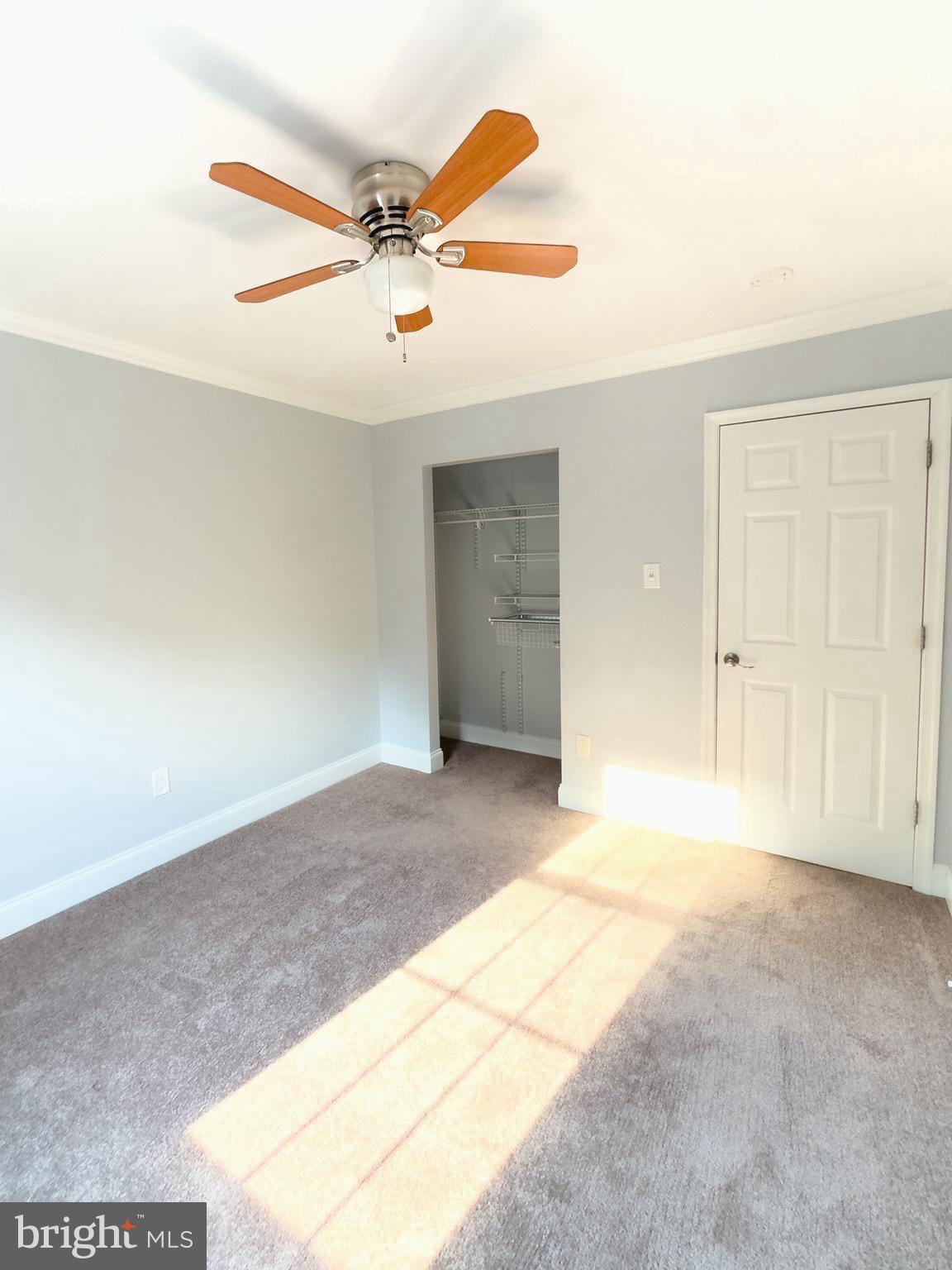 2419 Ansdel Court Reston, VA 20191 - Photo 24 of 41 an empty room with windows and fan