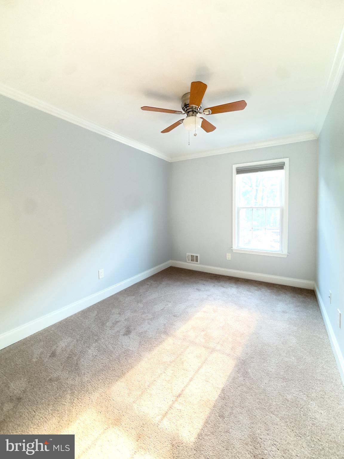 2419 Ansdel Court Reston, VA 20191 - Photo 25 of 41 an empty room with a window and a ceiling fan