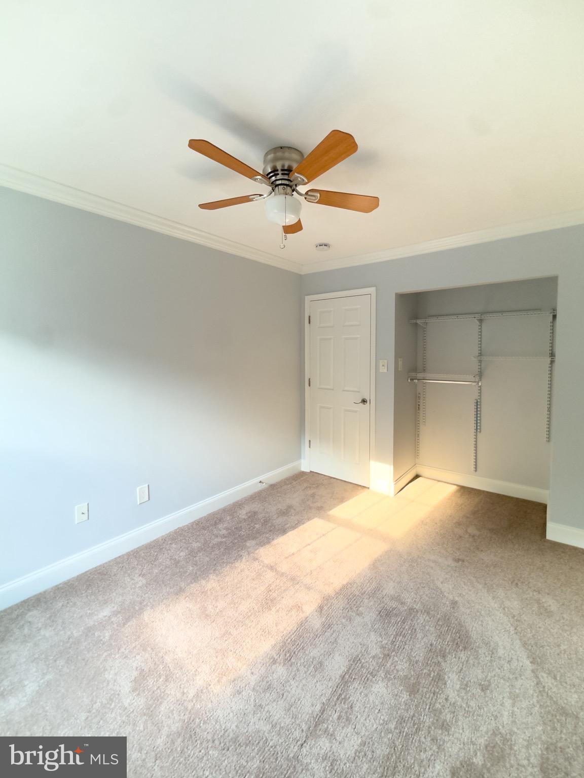 2419 Ansdel Court Reston, VA 20191 - Photo 26 of 41 an empty room with a ceiling fan and window