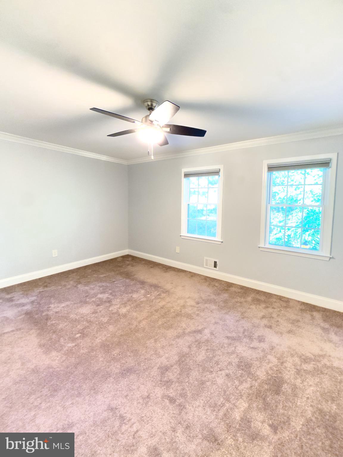 2419 Ansdel Court Reston, VA 20191 - Photo 29 of 41 an empty room with windows and ceiling fan