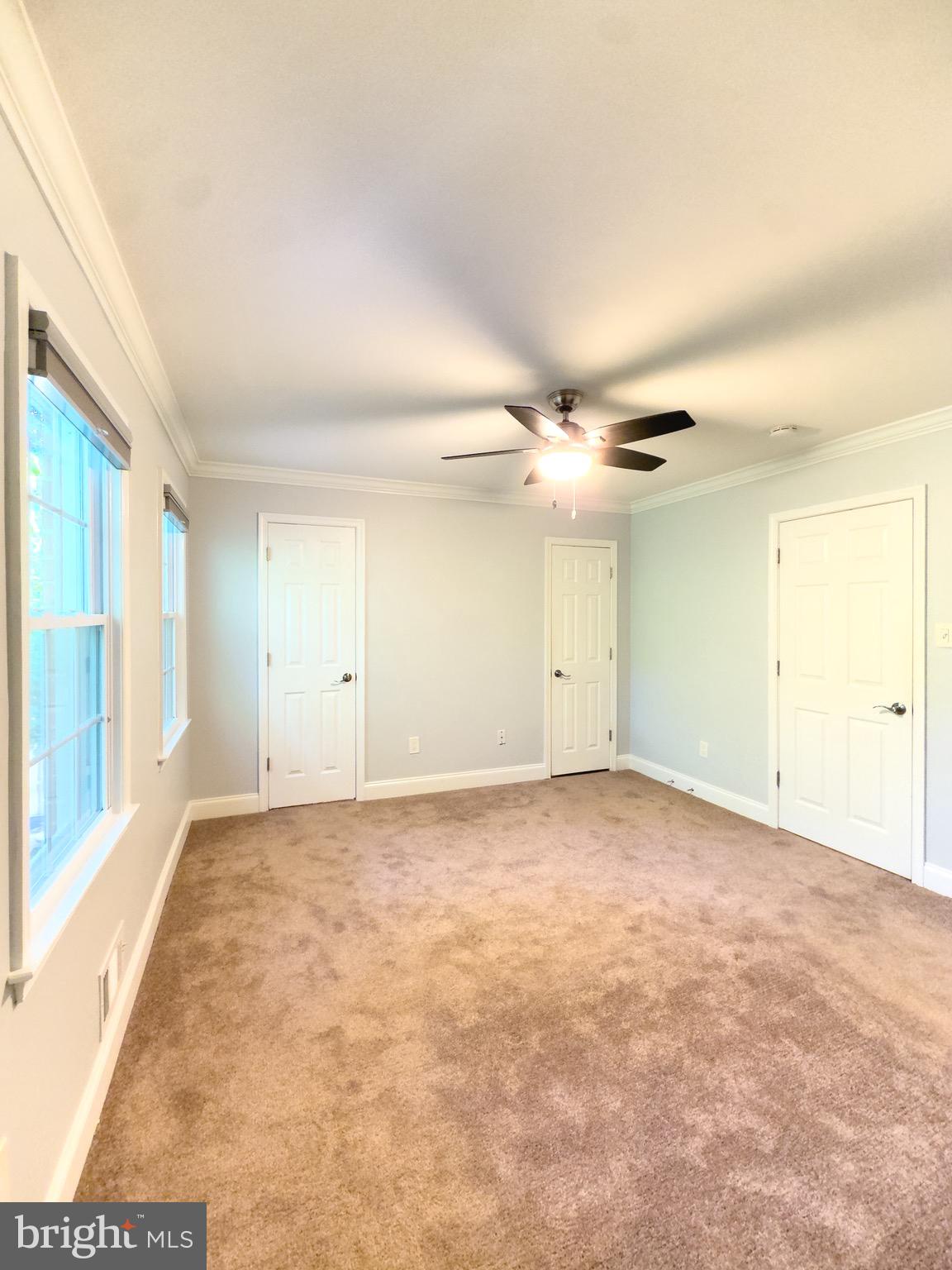 2419 Ansdel Court Reston, VA 20191 - Photo 30 of 41 en empty room with windows and ceiling fan