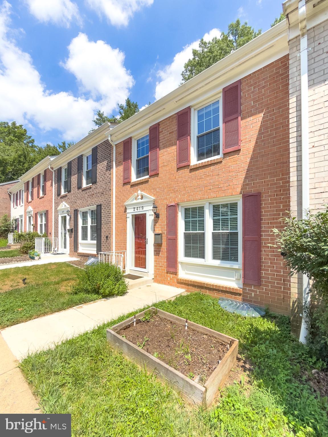 2419 Ansdel Court Reston, VA 20191 - Photo 3 of 41 front view of a house with a yard