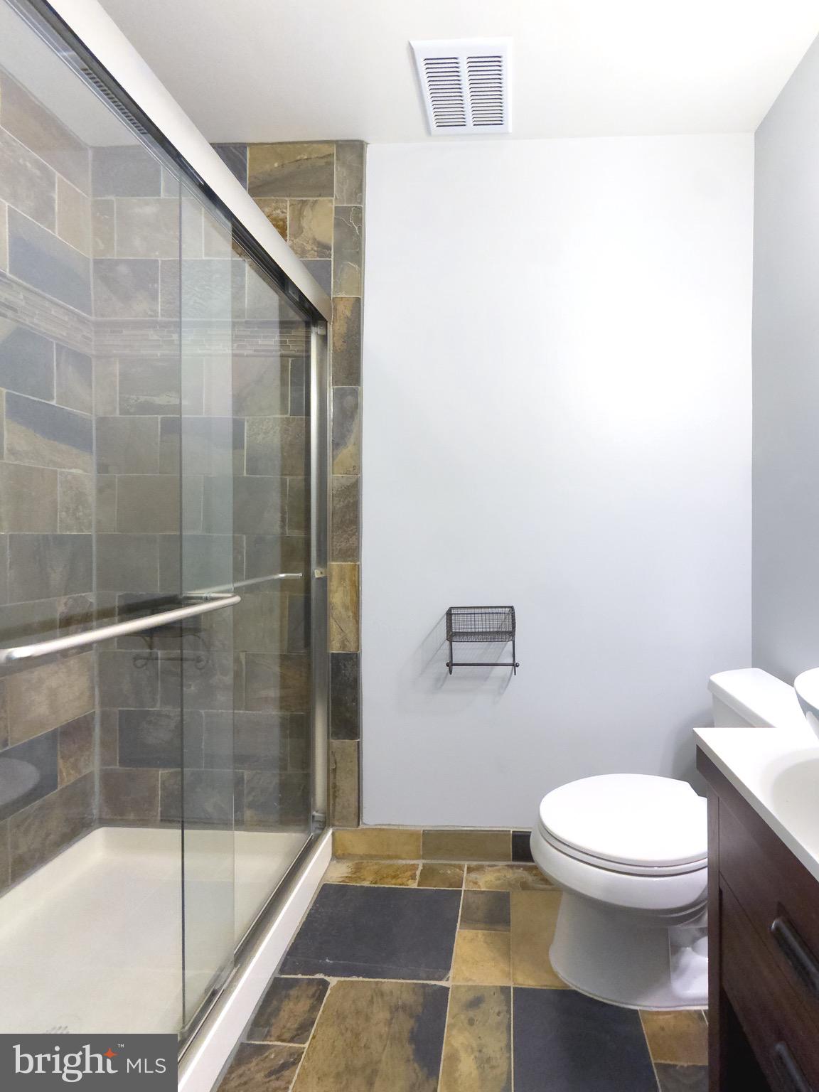 2419 Ansdel Court Reston, VA 20191 - Photo 31 of 41 a bathroom with a toilet and a shower