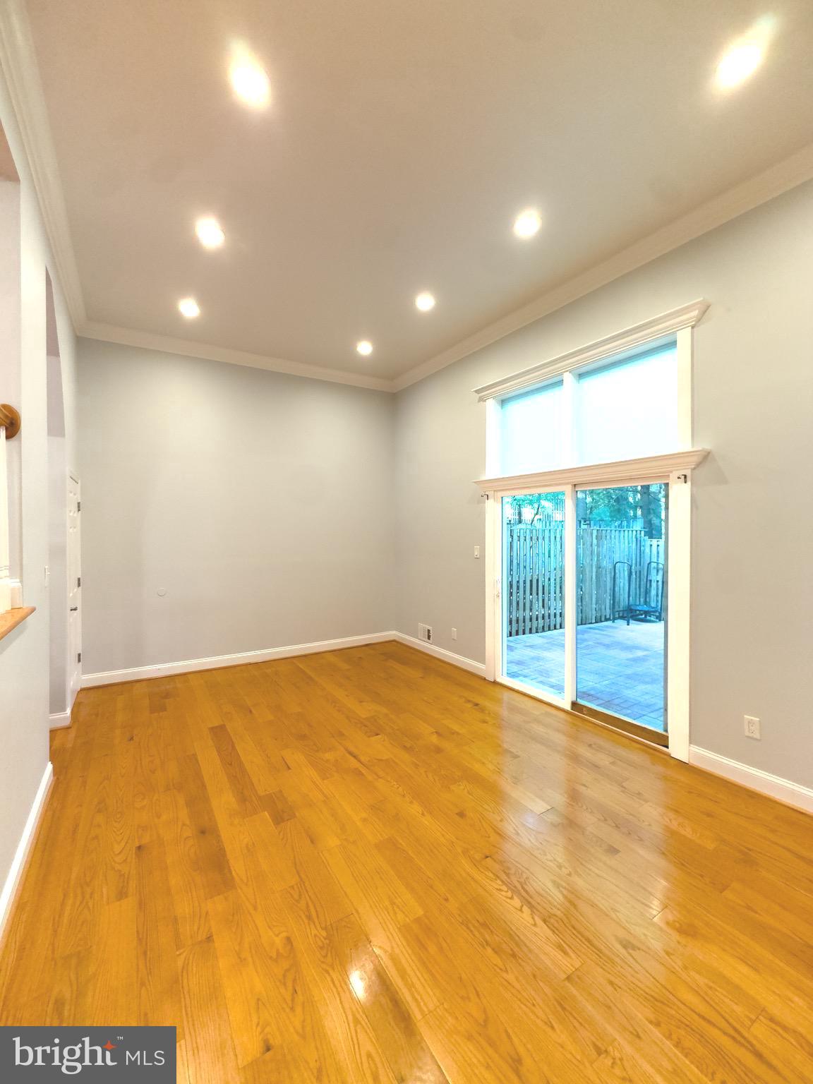 2419 Ansdel Court Reston, VA 20191 - Photo 10 of 41 a view of an empty room with wooden floor and a window