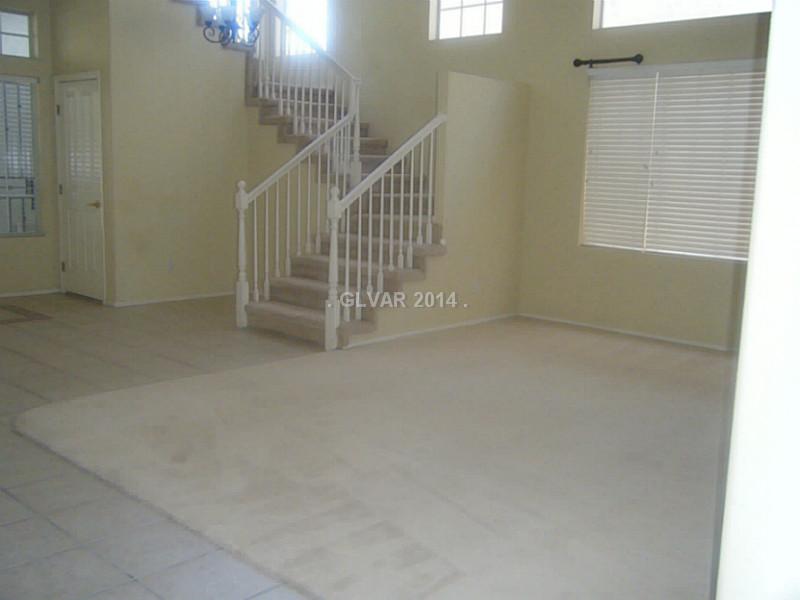 192 Reed Lane Henderson, NV 89074 - Photo 8 of 34 Living Room. Open living room with soaring ceiling and double windows
