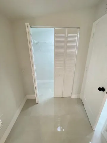 an empty room with a bench