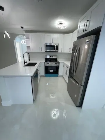 a view of a kitchen with a sink