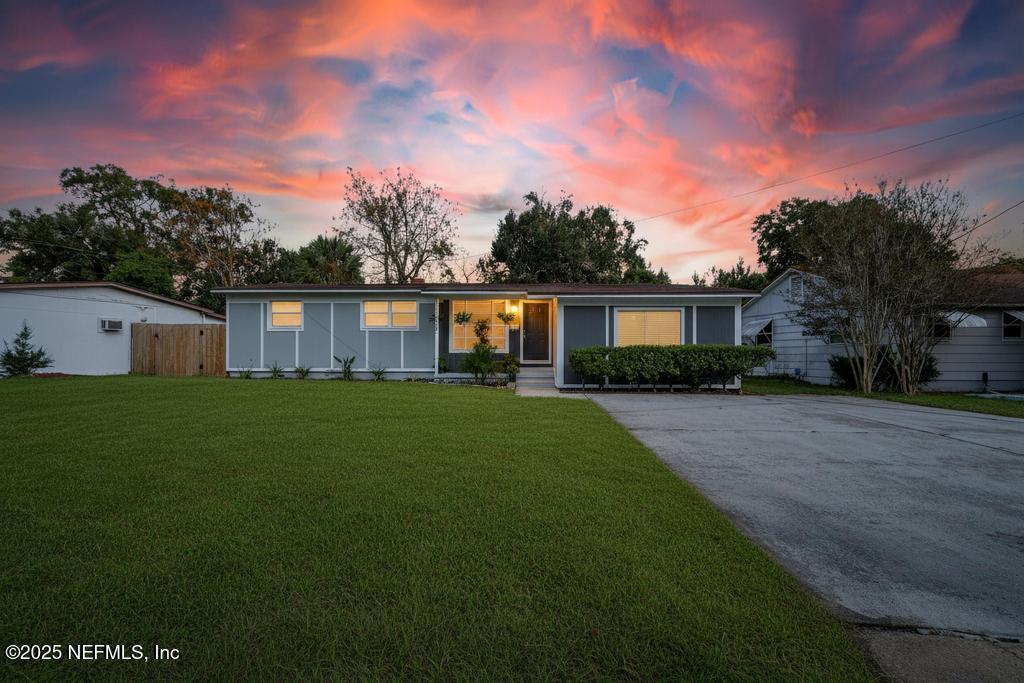 6619 Ector Road Jacksonville, FL 32211 - Photo 3 of 70 a front view of a house with a garden