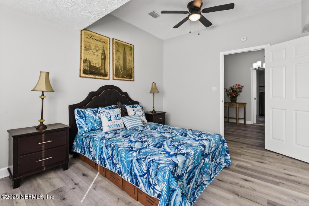 6619 Ector Road Jacksonville, FL 32211 - Photo 36 of 70 a bedroom with a bed and wooden floor