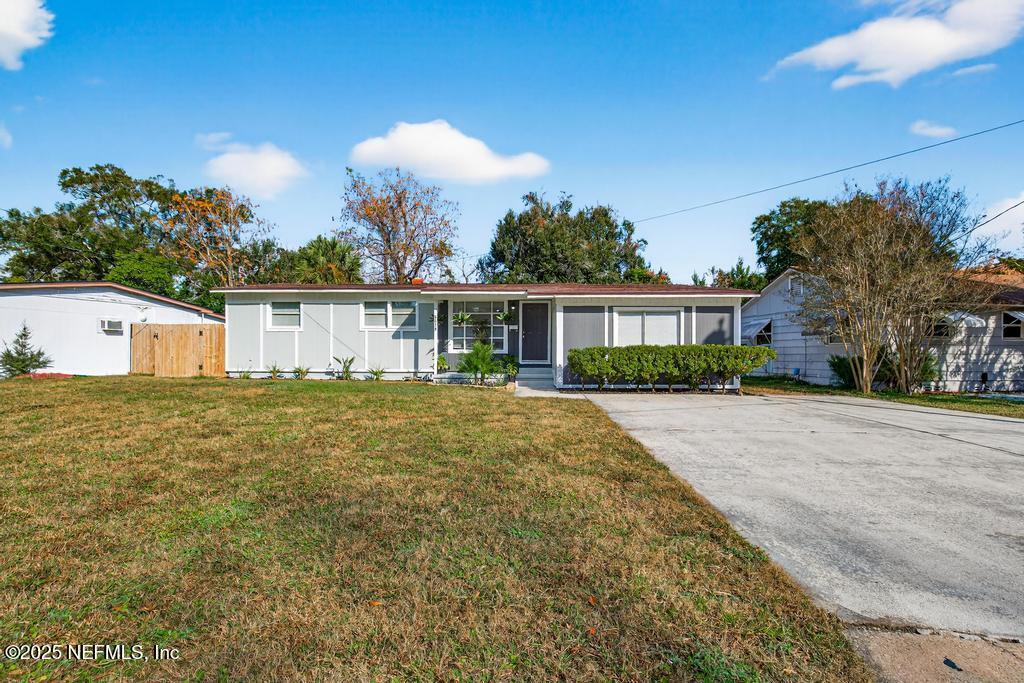 6619 Ector Road Jacksonville, FL 32211 - Photo 6 of 70 a front view of a house with a garden