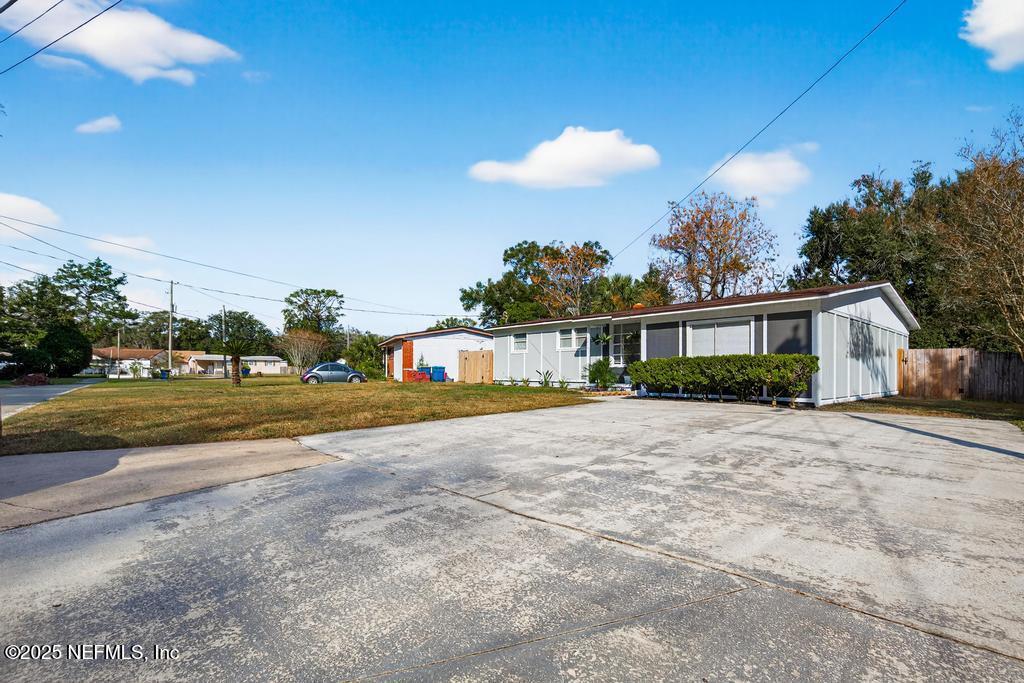 6619 Ector Road Jacksonville, FL 32211 - Photo 8 of 70 a view of a house with a yard