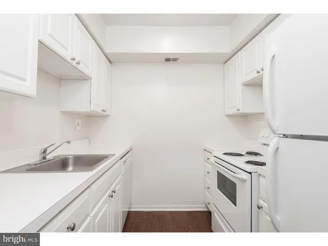 a bathroom with a toilet and a sink